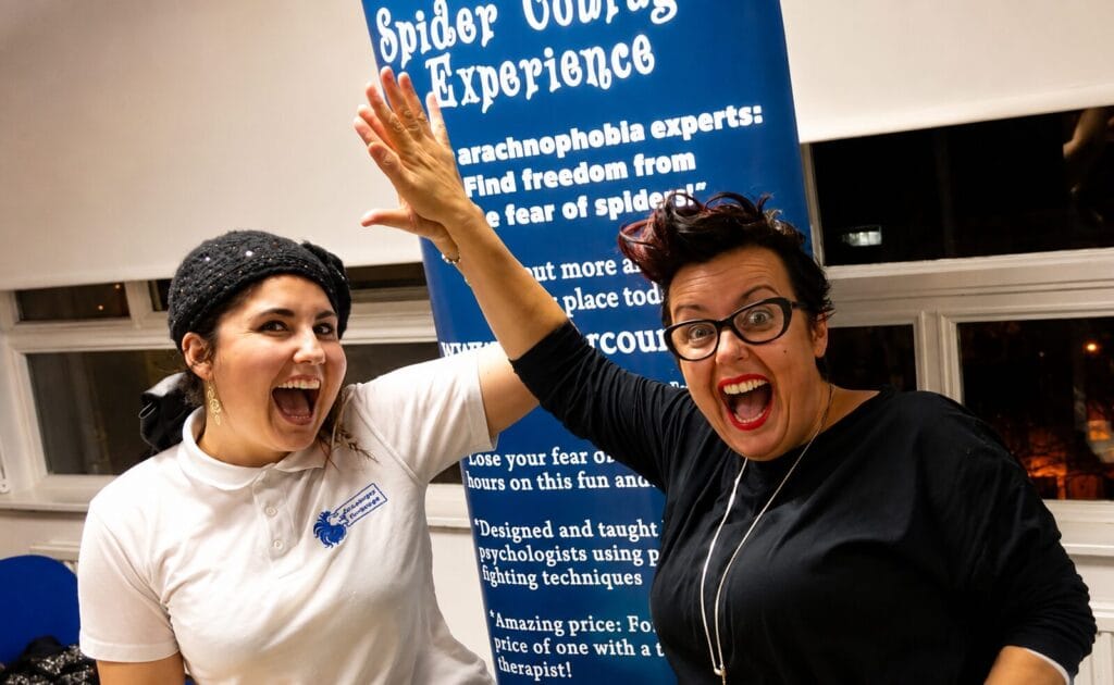 Britain Stelly high-fiving a client after success at the Spider Courage Experience workshop Creature Courage 
